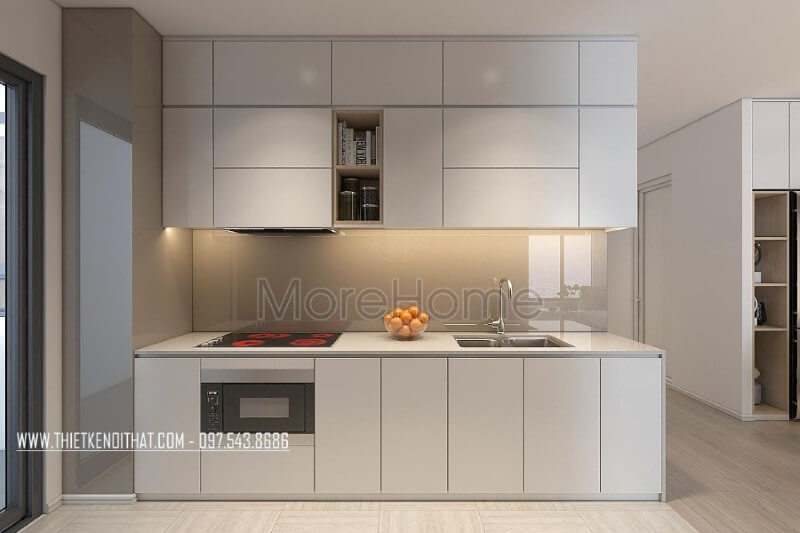 Mẫu tủ bếp kiểu dáng chữ i gỗ công nghiệp màu trắng kết hợp phân chia các ngăn tủ một cách hợp lí, tạo cho người nội trợ thuận tiện hơn trong quá trình mang lại những bữa cơm ngon miệng cho những người thân yêu của mình Tủ bếp gỗ công nghiệp và tủ bếp acrylic